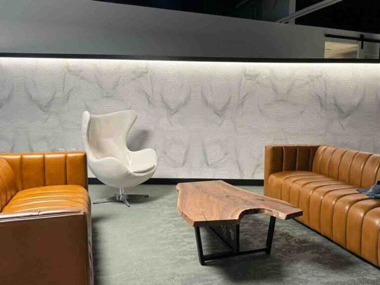 commercial wallpaper installation Denver Colorado textured vinyl wallcovering office lounge modern seating area accent wall