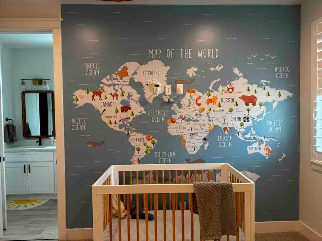 world map mural wallpaper nursery installation Evans peel and stick accent wall