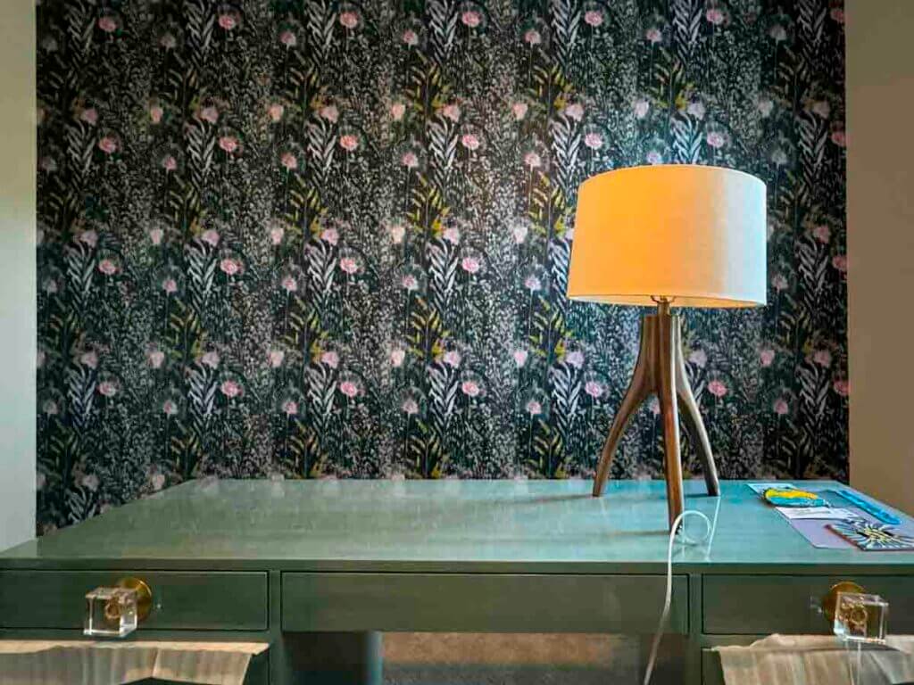 dark floral wallpaper installation Boulder Colorado desk lamp interior peel and stick wallpaper detail