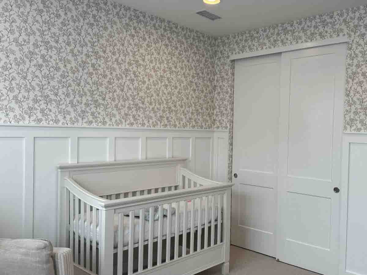 Nursery wallpaper installation Englewood Pottery Barn style floral wallpaper wainscoting