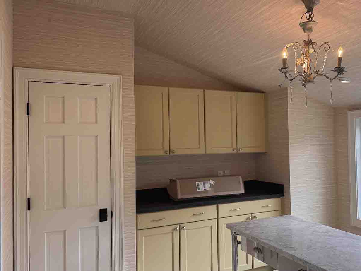 Vinyl grasscloth wallpaper installation room cabinets chandelier Denver metro area