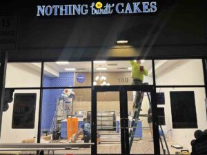 Commercial Type II vinyl wallpaper installation at Nothing Bundt Cakes in Fort Collins, Colorado during an overnight commercial construction project