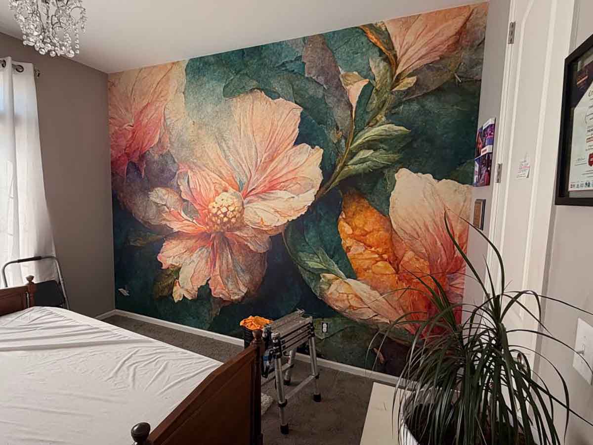 Professional floral wall mural installation in Evergreen, Colorado featuring a large botanical flower mural in a primary bedroom with seamless panel alignment.
