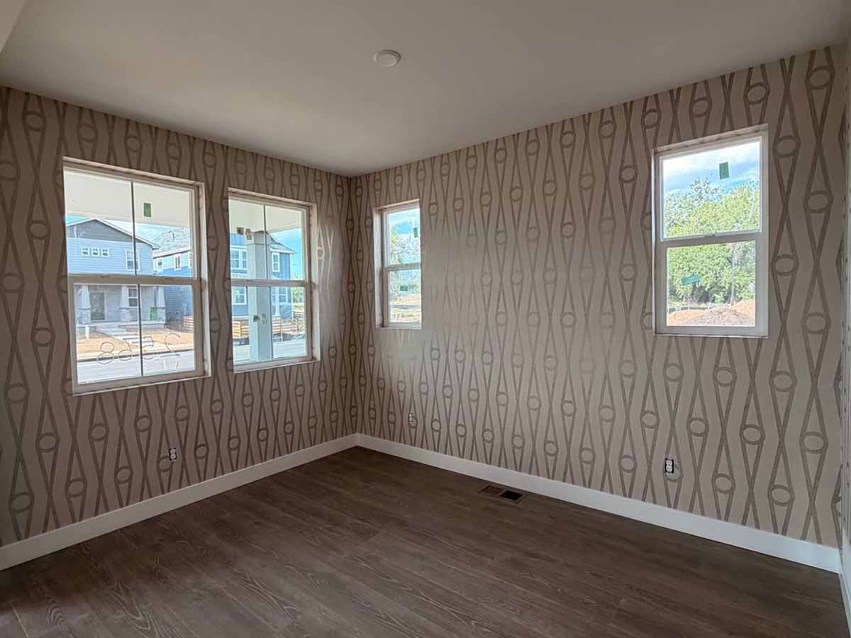 Professional geometric wallpaper installation in Fountain, Colorado featuring a contemporary full-room wallcovering with seamless pattern matching and precision finishing.