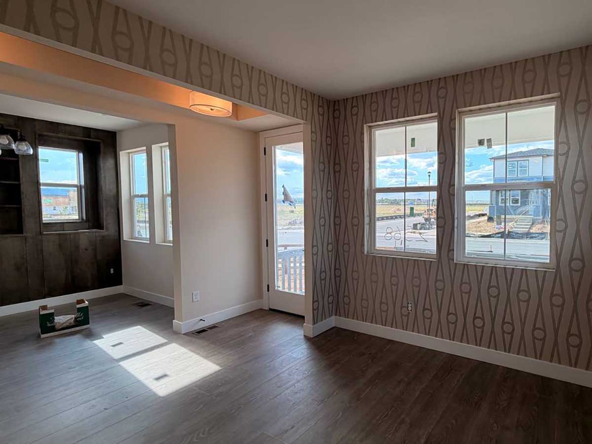 Professional geometric wallpaper installation in Frisco, Colorado featuring a contemporary full-room wallcovering in an open-concept living space with seamless pattern matching.