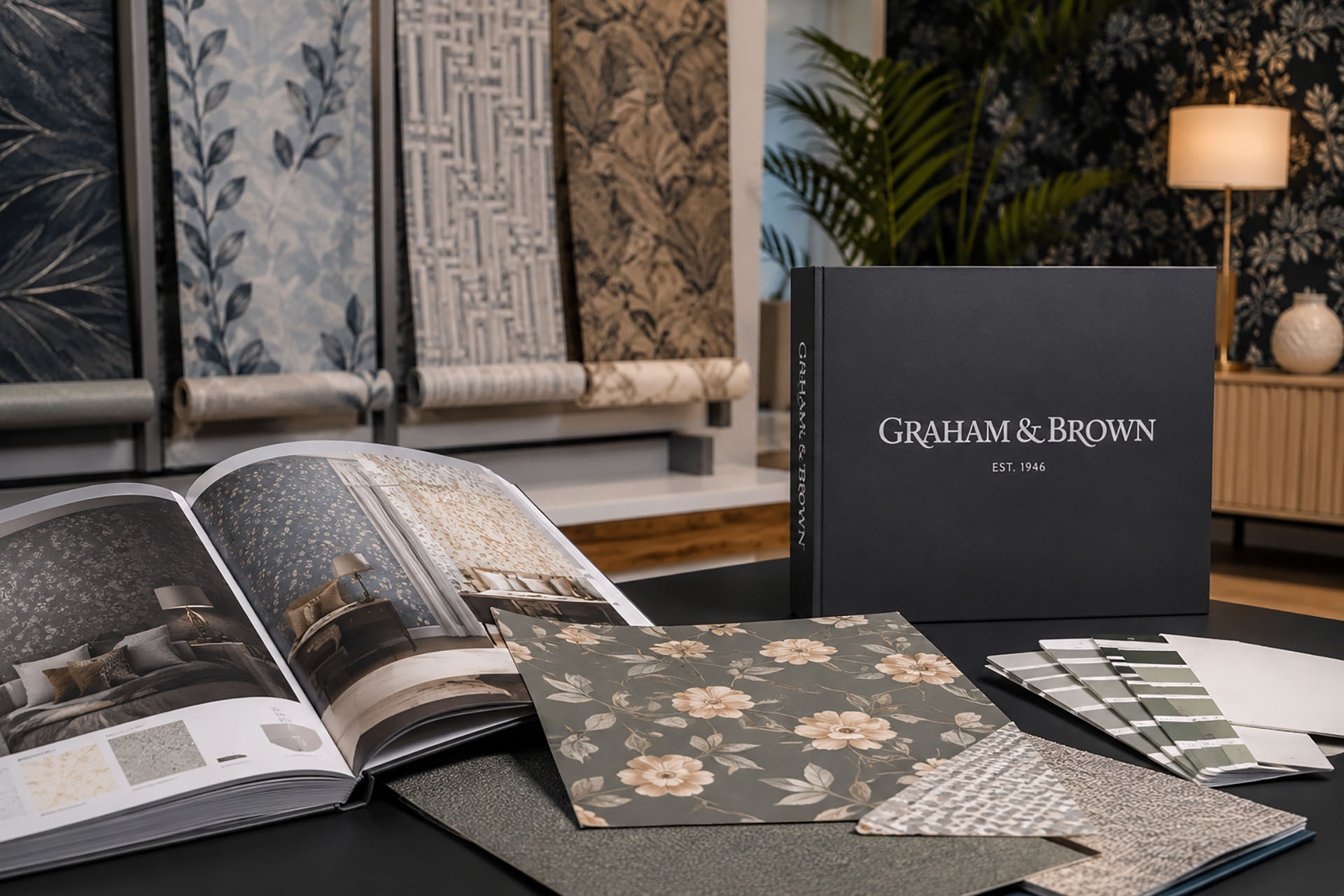 Graham & Brown wallpaper samples and designer collections displayed in a professional interior design showroom